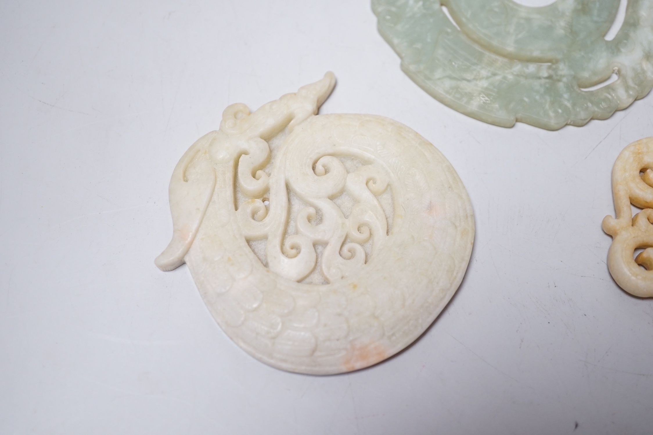 A Chinese bi disc and two other hardstone carvings